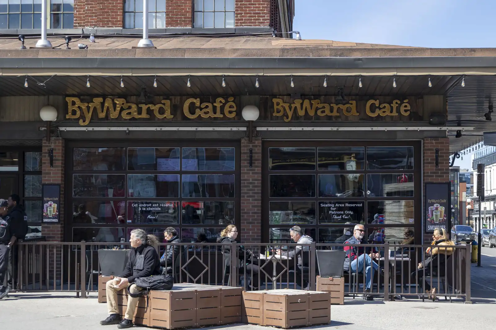 People sitting outside a café in Ottawa’s ByWard Market on a sunny day
